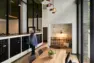 Coworking lounge at Tanager Apartments with storefront windows and abundant natural light. Tanager Apartments – Board & Vellum
