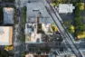 Aerial plan view of Tanager Apartments showing solar panels and roof top amenity spaces, with the central courtyard below, between the two towers. – Tanager Apartments – Board & Vellum