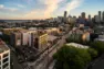 Aerial view of Tanager Apartments on its triangular block formed by Madison, Union, and 14th on Capitol Hill. – Tanager Apartments – Board & Vellum