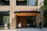 Close up on the entrance to the Tanager Apartments off East Union Street. - Tanager Apartments – Board & Vellum