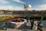 A campsite-inspired fire pit with iron grill sits off a space to pitch a small tent for a camping sleepover in the city. – Tanager Apartments – Board & Vellum