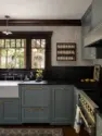 A decorative spice rack with brushed metal rails feels at home among the Craftsman details of the kitchen. - Tangletown Craftsman – Interior Design for a Craftsman Home – Board & Vellum