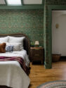 Green trim frames the opening into the reconfigured suite, with Morris & Co.'s Blackthorn wallpaper carried across the walls. - Tangletown Craftsman – Interior Design for a Craftsman Home – Board & Vellum