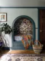 An arched niche in the front bedroom holds a full bed, papered inside in Cole & Son’s Frutto Proibito, with a deep drawer for storage underneath. - Tangletown Craftsman – Interior Design for a Craftsman Home – Board & Vellum