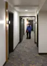 Interior residential corridor connecting homes at Tanager Apartments. – Tanager Apartments – Board & Vellum